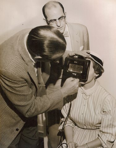 Dr. Lawrence Fitch examining a patient