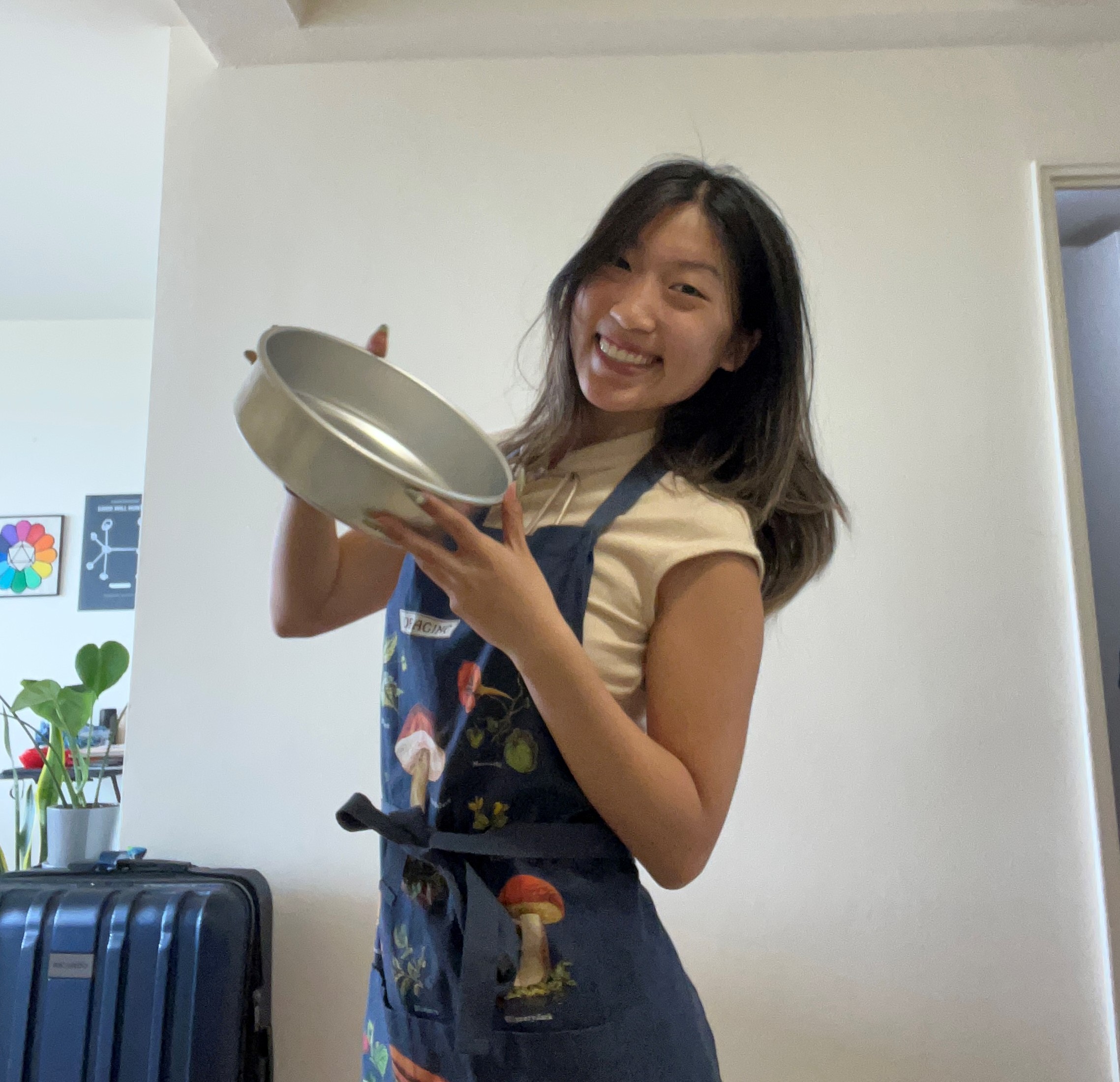 Liz Luan with baking pan in apron