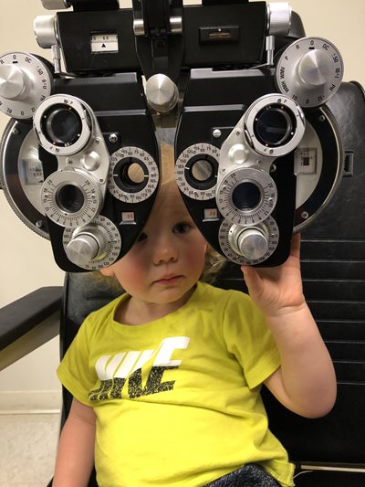 Luke Brackley in an eye exam chair