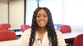 Student Maleiah Carroll shown smiling in well-lit Salus classroom.