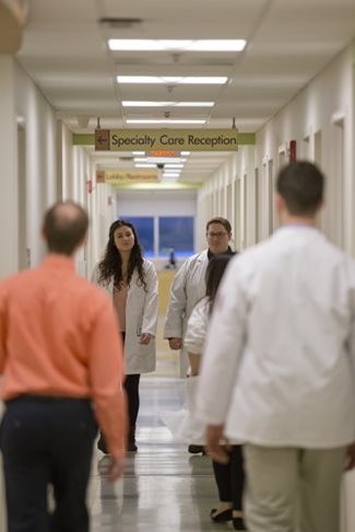 Doctors walking through a TEI hallway