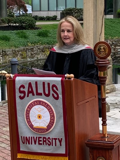 Madeleine Dean in her graduation regalia