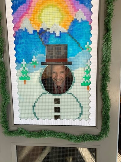 Dr. Mittelman with a holiday door