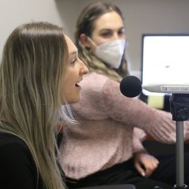 Patient doing speech therapy into a microphone