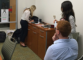 students conducting hearing exams