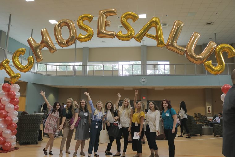 Students with "I Chose Salus" balloons