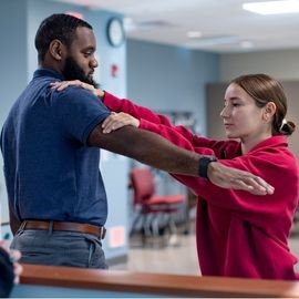 Occupational therapist working with a patient