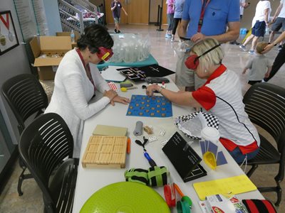 Dr. Perla playing adaptive board game