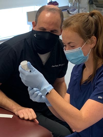 PA lab with faculty and student wearing mask