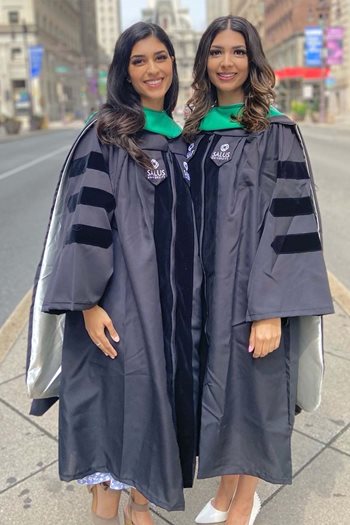 Sonia and Maya Panchal wearing their graduation regalia