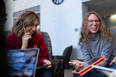 Two students laughing