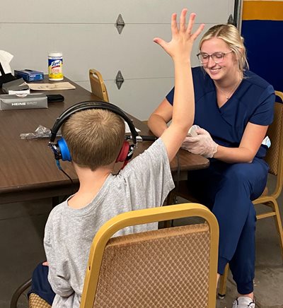 Audiology student conducts screening