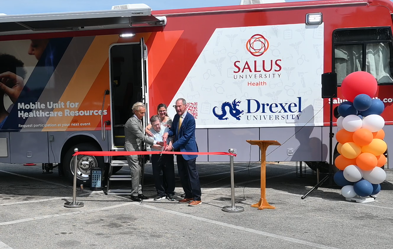 ribbon cutting of the big red bus