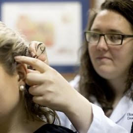 Dr. Elizabeth Sedunov working with a patient