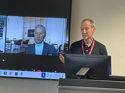 Dr. Mittelman speaking and Dr. Smith on Zoom