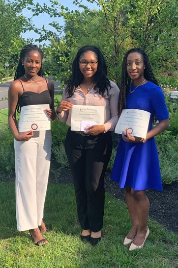 SEP students Dominica Dzakah, Charlene Caldwell and Ijeoma Onyejiukwa outside at closing ceremony.