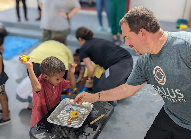 Bob Serianni working with a child in Turks & Caicos