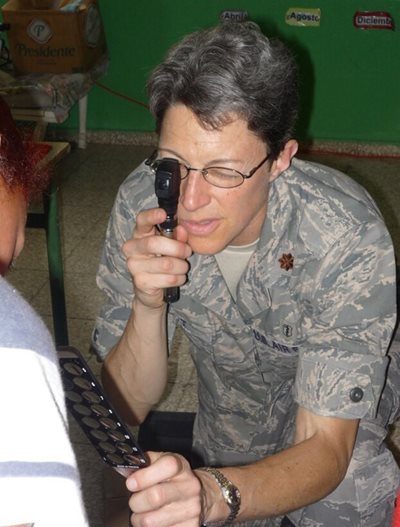 Stephanie Holt conducting an eye exam