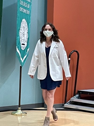 Sierra Niesen walking off stage at the white coat ceremony