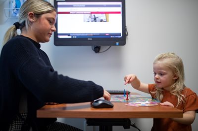 SLP student with child client