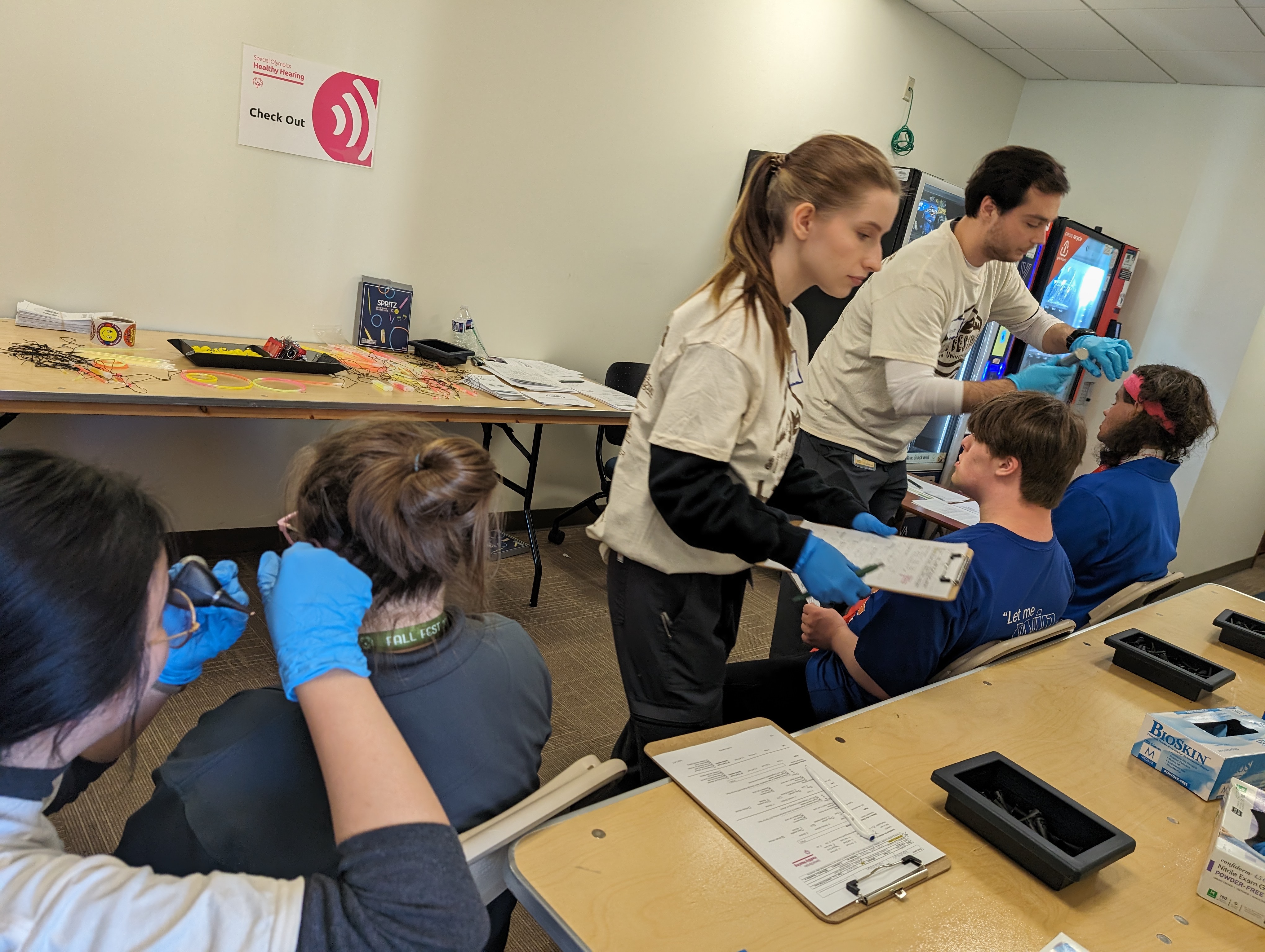 AUD student examine Special Olympics patients