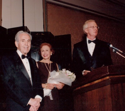 Marty and Florence Hafter on stage with Tom Lewis