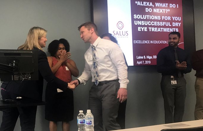 Dr. Trego and student shaking hands