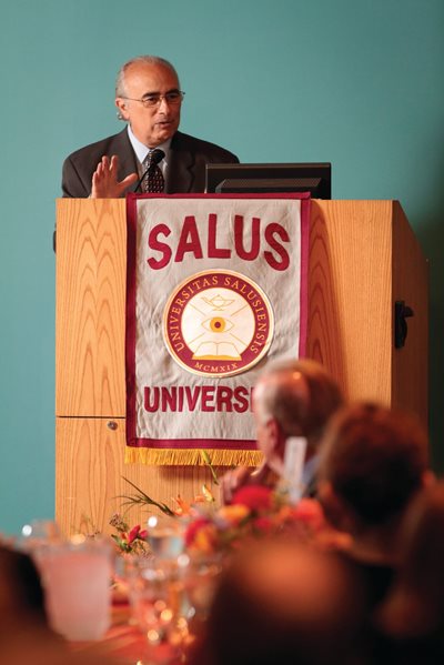 Tony Di Stefano speaking at a Salus podium