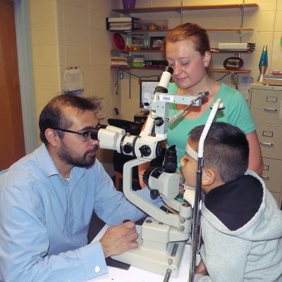 Dr. Trujilo working with a young patient