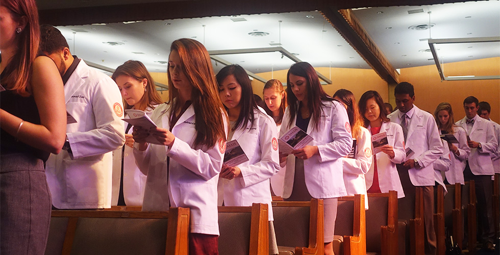 students in white coats