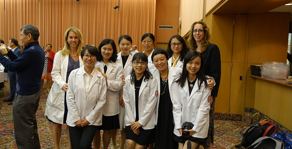 international students in white coats