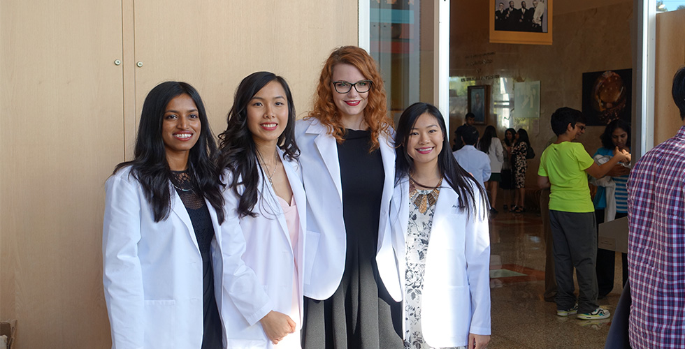 students in white coats