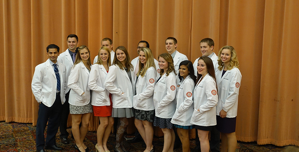 students in white coats