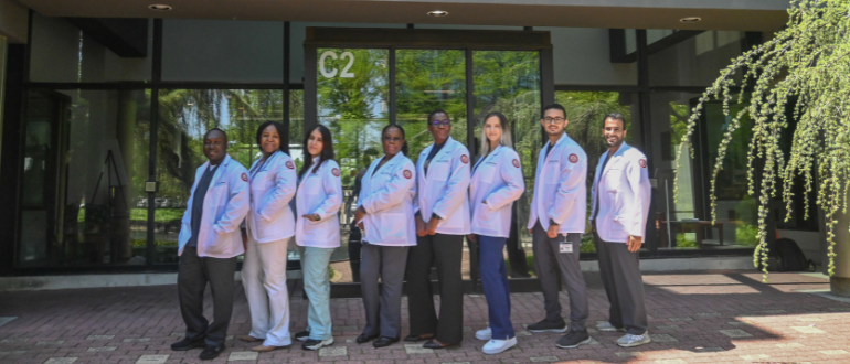 MSc6 cohort group photo outside of the main entrance