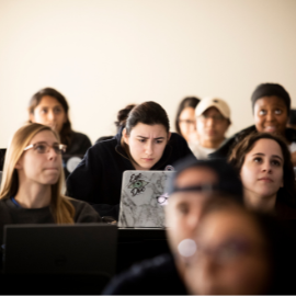 Student looking stressed at their computer