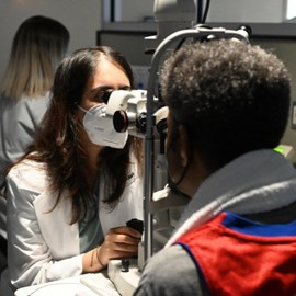 MSc6 Cohort student performing an eye exam