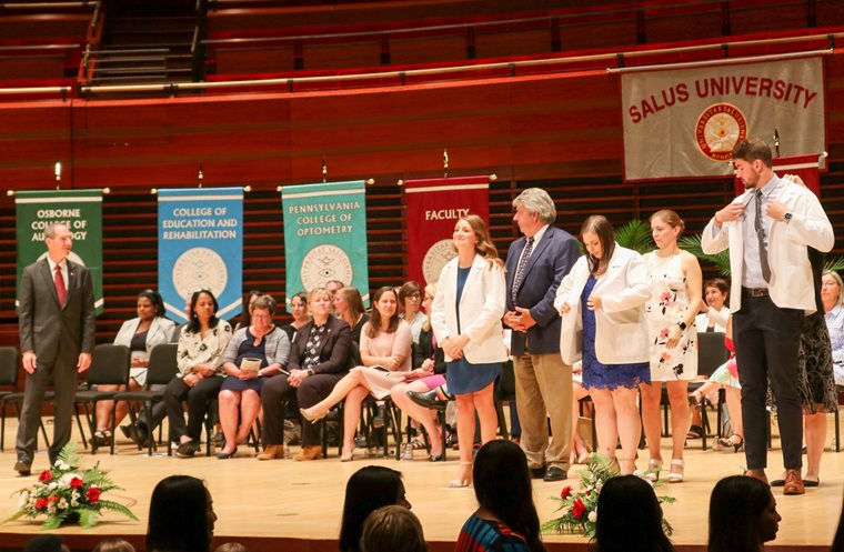 Students getting their white coats