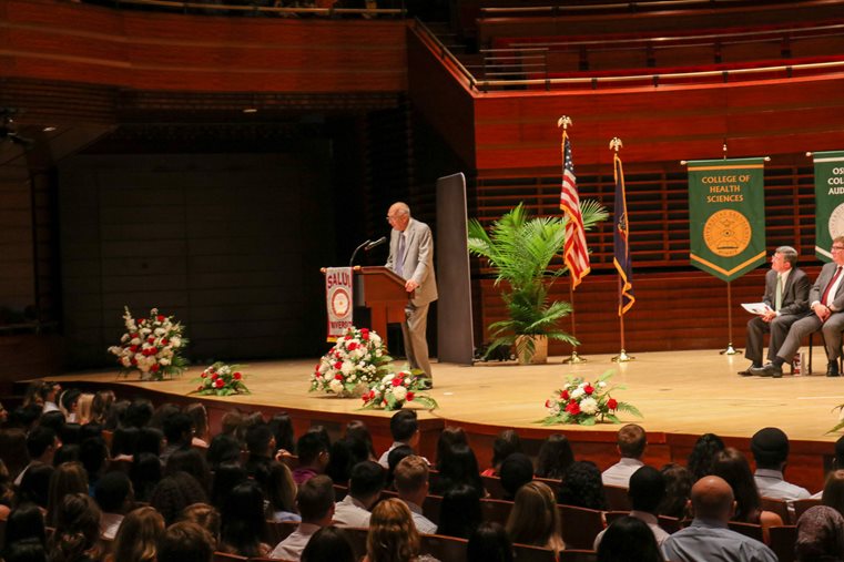 Michael Cowan speaking at the white coat ceremony