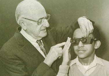 William Feinbloom with a patient