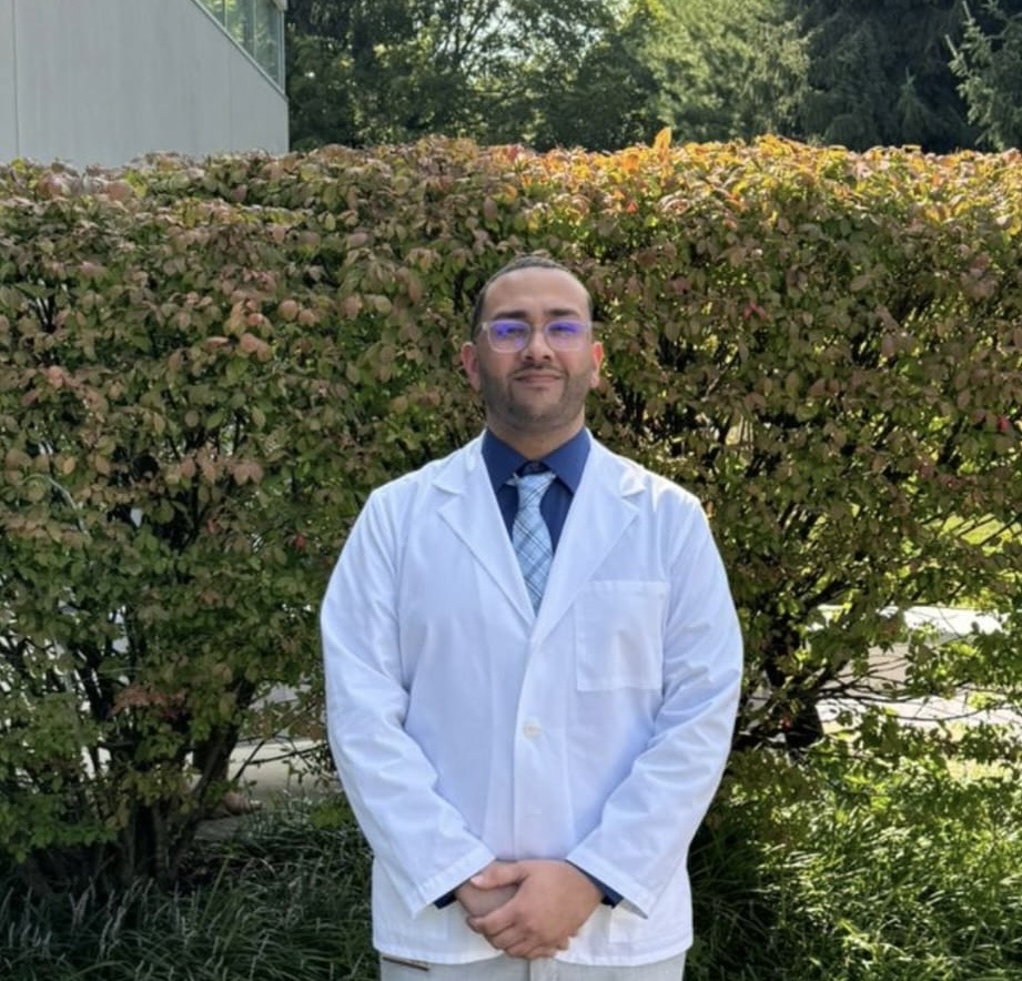 Emmanuel in his white coat