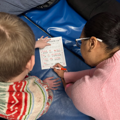 Ashley working with student