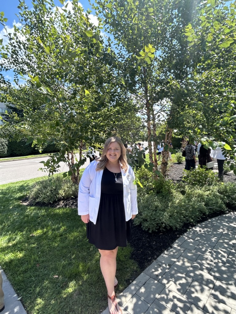 Sarah in her white coat