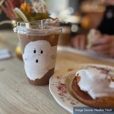 photo of donut and Halloween special coffee drink with cute ghost face design