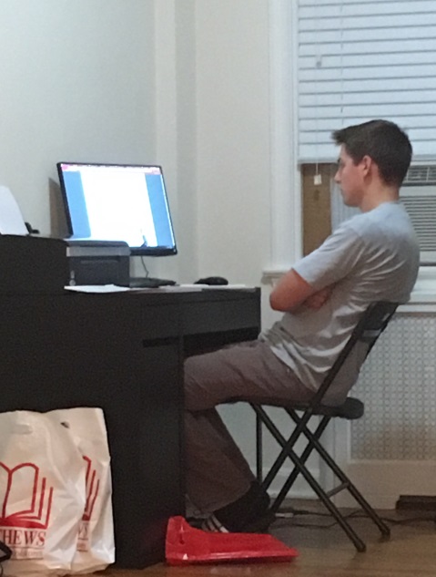 Cameron sitting in front of his computer