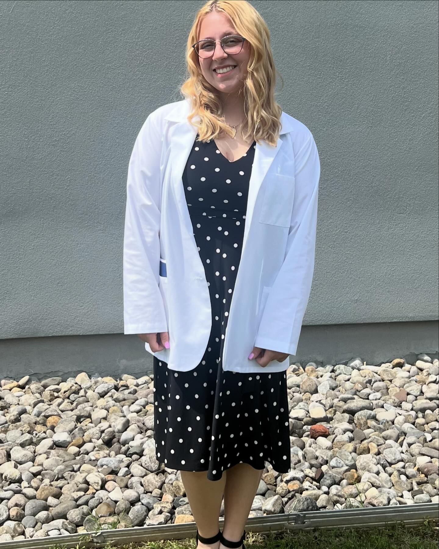 Emily in her white coat