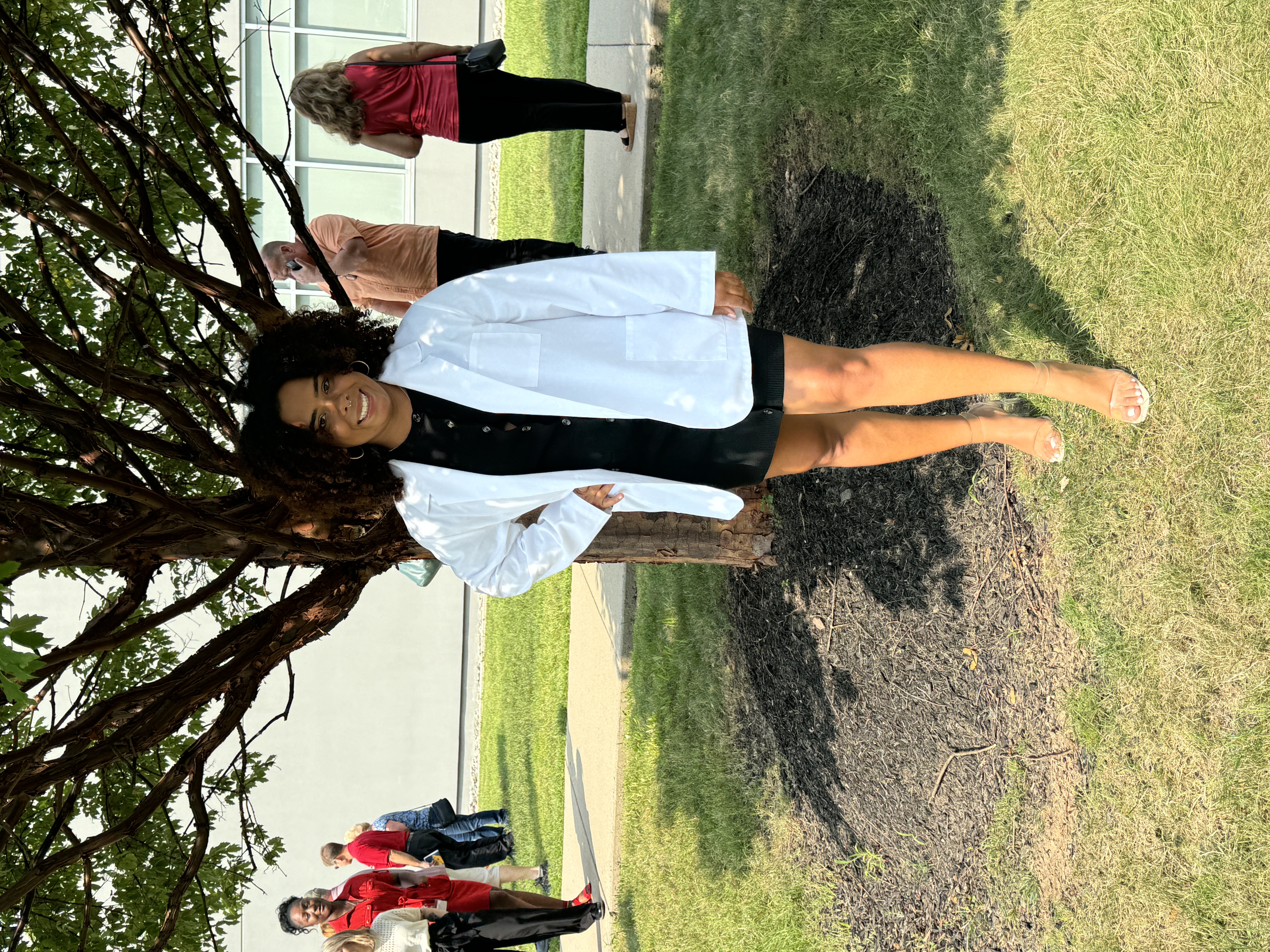 Anisa in her white coat