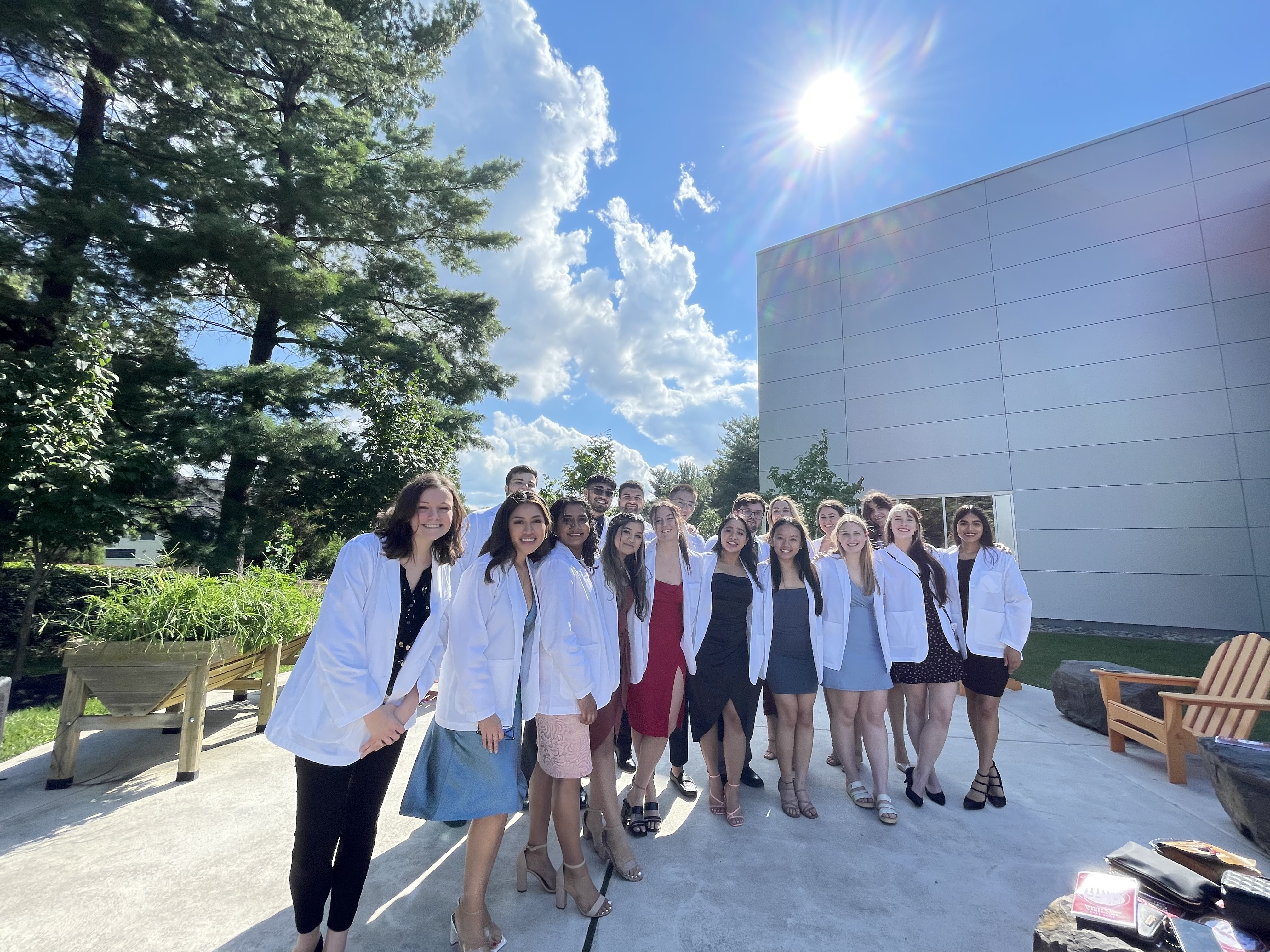 Maddy and friends wearing white coats