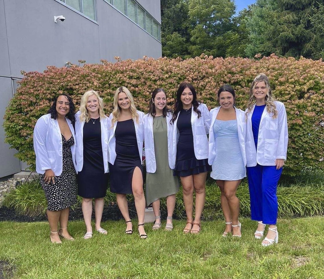 OT students in white coats