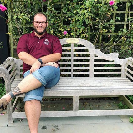 Jimmy sitting on a bench