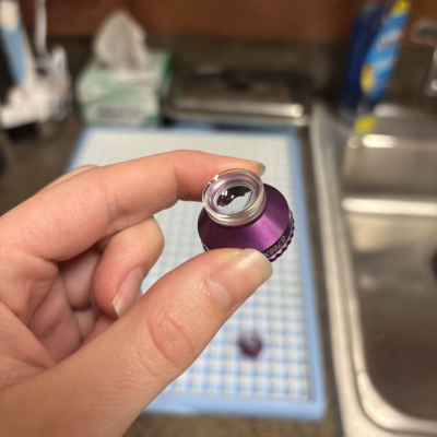 student holding lens
